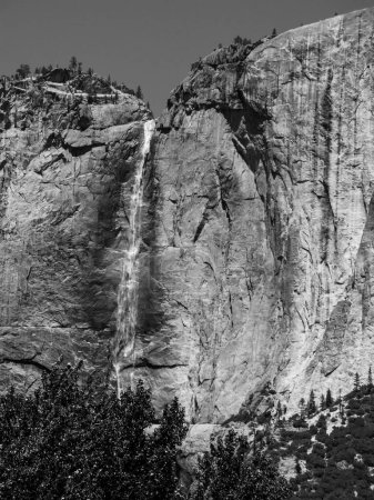 Photo for Famous rock formation with waterfall in the romantic valley of yosemite park - Royalty Free Image