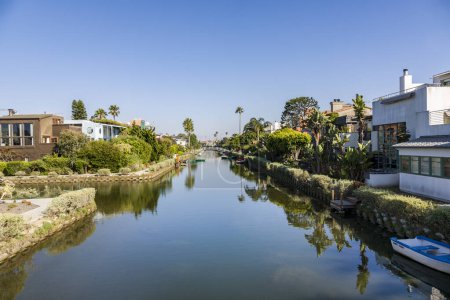 Photo for Venice, USA - July Y 6, 2008: old canals of Venice, build by Abbot Kinney in California, beautiful living area with boats and residential houses. - Royalty Free Image
