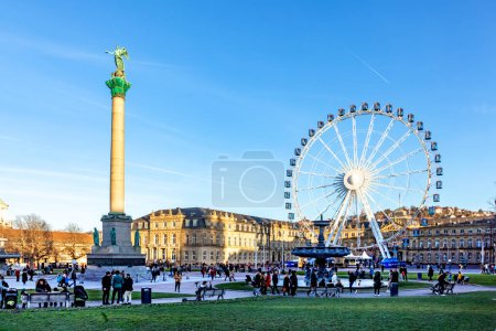 Photo for Stuttgart, Germany - January 7, 2023: Ferris wheel in Stuttgart city in front of the new castle in operation. - Royalty Free Image