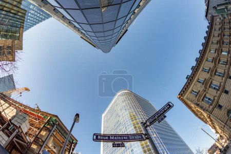 Téléchargez les photos : Frankfurt, Germany - February 8, 2023: fisheye perspective of skyscraper downtown financial district in Frankfurt, Germany. - en image libre de droit