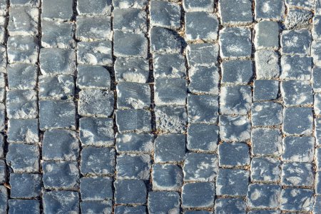Téléchargez les photos : Pattern of old historic cobble stones at the street in harmonic light - en image libre de droit