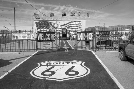 Photo for Flagstaff, USA - March 9, 2019: scenic view to shop selling Route 66 souvenirs and emblem from route 66 at bitumen floor. - Royalty Free Image