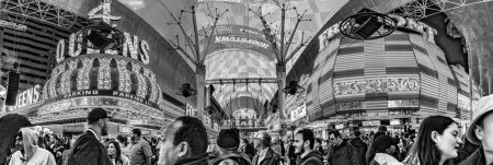 Photo for Las Vegas, USA - March 9, 2019: Fremont Street with many neon lights and tourists in downtown Las Vegas. It was the first paved street in Las Vegas in 1925. - Royalty Free Image