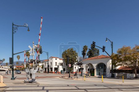 Photo for Santa Barbara, USA - March 16, 2019: old historic town square in Santa Barbara with train crossing in foreground and historic buildings of old town. - Royalty Free Image