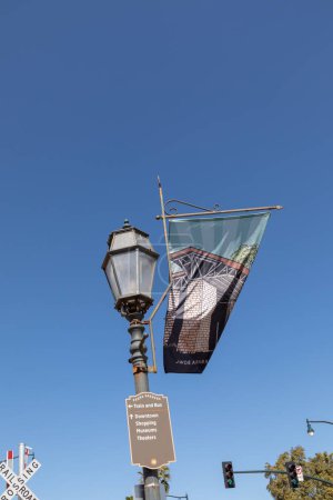 Photo for Santa Barbara, USA - March 16, 2019: old historic lantern with flag of the old train station and signage of the touristic landscapes in Santa Barbara for tourist orientation. - Royalty Free Image