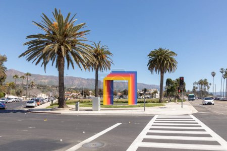 Photo for Santa Barbara, USA - March 16, 2019:  Herbert Bayers Chromatic Gate at the  Cabrillo Ball Park with palm trees. - Royalty Free Image