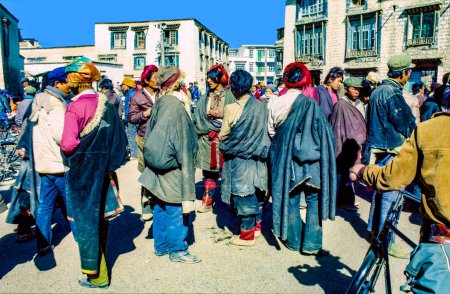 Photo for Lhasa, China - November 2, 1983: local people from the hills meet in the old part near the Jokhang palace in Lhasa, China. - Royalty Free Image