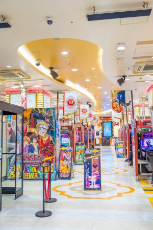 Photo for Tokyo, Japan - March 16, 2023: Arcade bet casino games. People plays video game in Tokyo arcade Pachinko Parlor Akasaka. mechanical arcade game originating in Japan. - Royalty Free Image