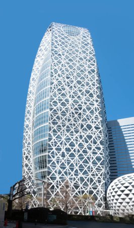 Photo for Tokyo, Japan - March 19, 2023: Close up on the futuristic skyscraper of the Tokyo mode gakuen cocoon tower designed by architect Noritaka Tange as cocoon shape in the business district of shinjuku. - Royalty Free Image