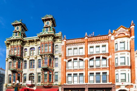 Photo for San Diego, June 11, 2012:  facade of historic houses in the gaslamp quarter  in San Diego, USA. The area is a historic district on the National Register of Historic Places and dates back to 1867. - Royalty Free Image