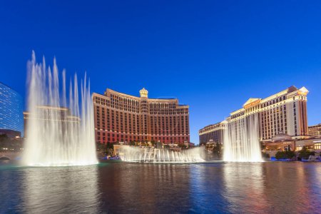 Photo for Las Vegas, USA - June 15, 2012: Las Vegas Bellagio Hotel Casino, featured with its world famous fountain show, at night with fountains in Las Vegas, Nevada. - Royalty Free Image