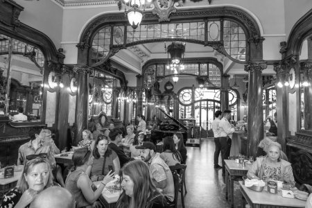 Photo for Porto, Portugal - May 4, 2023: people enjoy the style, cake and Interior of the Majestic cafe in Porto. - Royalty Free Image