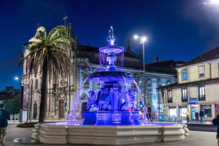 Photo for Porto, Portugal - May 4, 2023: Fountain and the baroque Igreja do Carmo, Church of the Song, in Porto. - Royalty Free Image