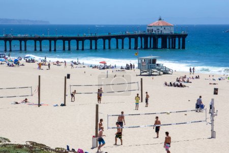 Photo for Redondo Beach, USA - June 24, 2012:  people enjoy the  beautiful beach in Redondo beach  with volleyball courts and old wooden pier, Los Angeles, USA - Royalty Free Image
