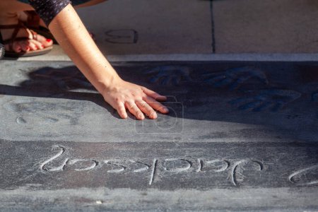 Photo for Los Angeles, USA - June 24, 2012: handprints of Michael Jackson at the concrete of Chinese Theatre's forecourts.  There are nearly 200 celebrity handprints in the concrete of the forecourt. - Royalty Free Image