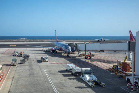 Photo for Lanzarote, Spain - February 5, 2023: aircraft at apron at airport Cesar manrique in Arrecife, Lanzarote, Spain with new terminal building. - Royalty Free Image