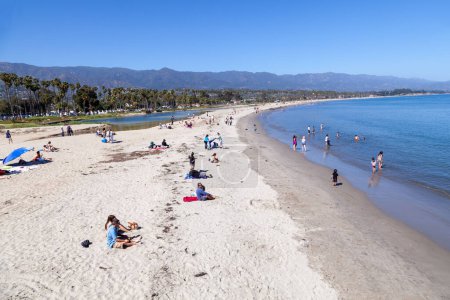 Photo for Santa Barbara, USA - June 23, 2012: people enjoy the scenic sandy big beach in Santa Barbara at the pacific ocean for swimming and sun tanning. - Royalty Free Image