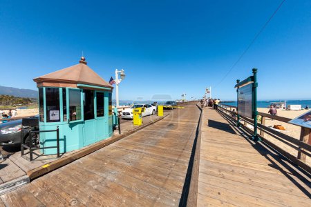 Photo for Santa Barbara, USA - June 23, 2012: scenic view to historic wooden pier in Santa Barbara, USA with green painted entrance booth for cars. - Royalty Free Image