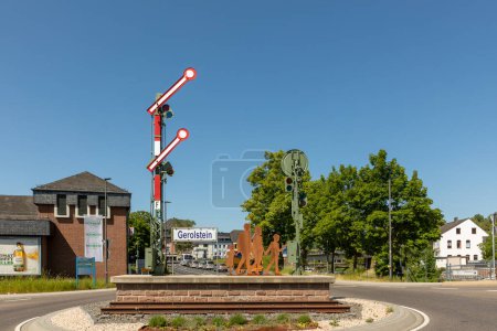Photo for Gerolstein, Germany - June 4, 2023: the worker for the town Gerolstein have inplemented a sculpture by itself with a signal and iron plate symbolizing people.  Helmut Pawlak assistet the worker. - Royalty Free Image