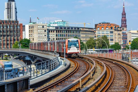 Photo for Hamburg, Germany - July 25, 2012:  train arrives at Baumwall U-Bahn Station in Hamburg. Hamburg U-Bahn (Metro Rapid Transit System) was opened in 1912 and comprises four lines with a length of 105 km in 2012. - Royalty Free Image