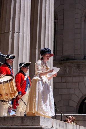 Photo for New York, USA - July 9, 2010: Ceremony for declaration of independence in old costumes takes place at the Washington statue in front of federal Hall National Memorial in New York, USA. - Royalty Free Image