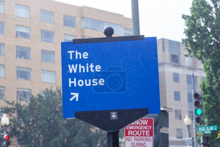 Photo for Street sign the white house with blue background in Washington in heavy rain, USA - Royalty Free Image