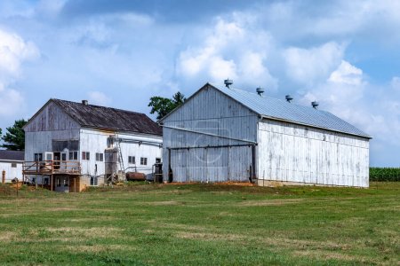 Photo for Farm house with field and silo in beautiful landscape - Royalty Free Image