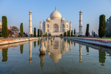 Photo for Agra, India - November 15, 2011: people visit Taj Mahal in India with reflection in pond. - Royalty Free Image