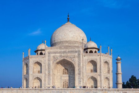 Photo for Taj Mahal in India under blue sky with the inscription of the coran in arabic letter meaning in english: This is an invitation to live on Earth as a good Muslim, Agra - Royalty Free Image