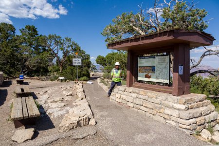 Photo for Grand Canyon, USA - July 9, 2008: starting point for the bright angel trail to the button of the grand canyon. A worker controls the trail.The west rim trail is closed. - Royalty Free Image