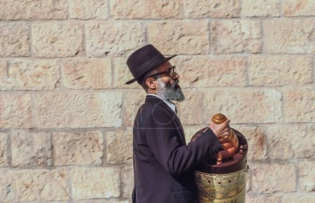 Photo for Jerusalem, Israel - January 1, 1995:   Orthodox jewish man prays at the Western Wall in Jerusalem, Israel. Israel's annexation of East Jerusalem in 1967, including the Old City, was never internationally recognized. - Royalty Free Image