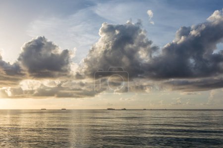 Photo for Scenic background of smooth waves at the sea with cloudscape - Royalty Free Image