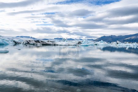 Photo for The joekulsar lagoon with icebergs  and eroding glacier in Iceland - Royalty Free Image