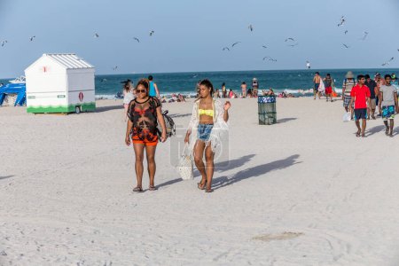 Photo for Miami, USA - August 30, 2014: People at the sea side in Miami, USA. Miami Beach is a popular destination among tourists, spiking during the winter time. - Royalty Free Image