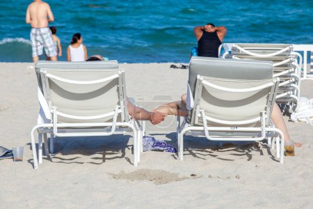 Photo for Miami Beach, USA - August 23, 2014: people enjoy the sunny day at south beach in Miami , USA. - Royalty Free Image