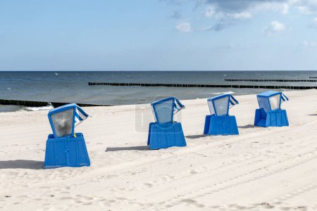 Photo for Typical beach chairs in Usedom. The first beach chair was build by Wilhelm Bartelmann in 1882. and ever since it is a symbol for the baltic sea. - Royalty Free Image