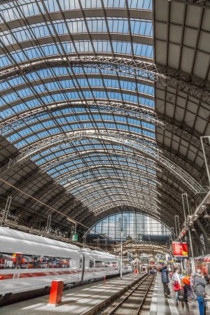 Photo for Frankfurt, Germany - May 16, 2014: Inside the Frankfurt central station in Frankfurt, Germany. People hurry to the intercity high speed train. - Royalty Free Image