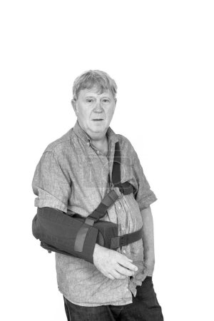 Photo for Caucasian mature man wearing a abduction brace - Royalty Free Image