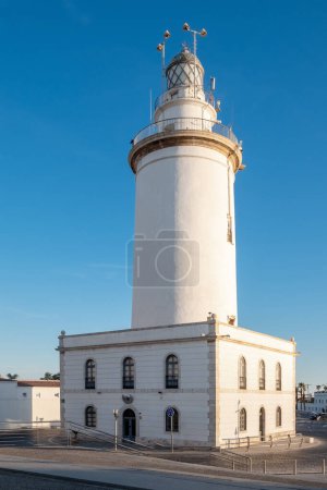Photo for View at white lighthouse building (La Farola). Malaga, Costa del Sol, Andalusia, Spain - Royalty Free Image