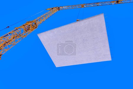 Photo for Waterproof cocrete wall on a hook of a crane at the construction site in Germany - Royalty Free Image
