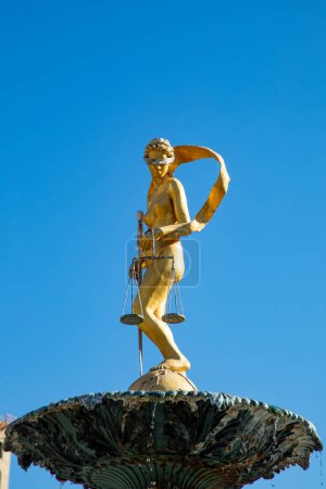 Photo for San Antonio, USA - October 31, 2023: Lady Justice Statue on Water Fountain with San Antonio Downtown Building in Background, Texas, USA - Royalty Free Image