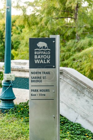 Photo for Houston, USA - October 21, 2023: sign buffalo bayou walk in the park direction sabine street and bridge. - Royalty Free Image