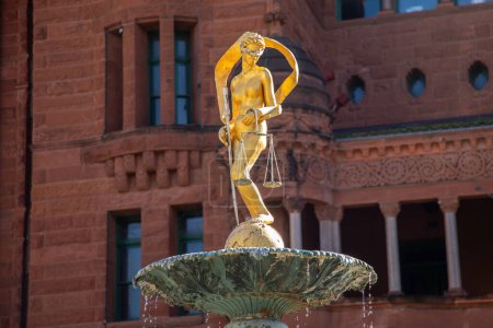 Photo for Lady Justice Statue on Water Fountain with San Antonio Downtown Building in Background, Texas, USA - Royalty Free Image