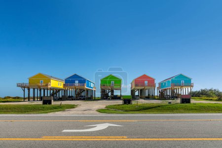 Photo for New beach houses at Port Bolivar on wooden stilts to protect against flooding, Texas, USA - Royalty Free Image