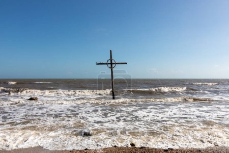 Photo for Cross in the ocean at bolivar peninsula used also for burial at sea, Texas, USA - Royalty Free Image