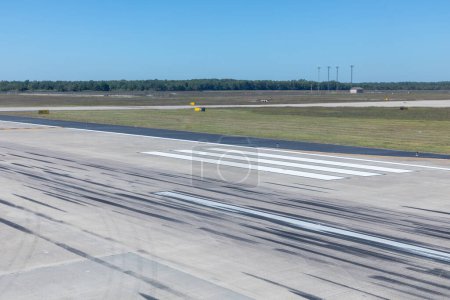 Photo for Detail of touchdown area with wheel marks at a runway for big jets - Royalty Free Image