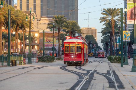 Photo for New Orleans, USA - October 25, 2023: people in New Orleans use the street car in early morning to go to town and work. - Royalty Free Image