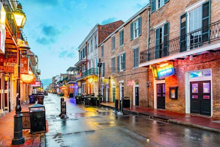 Photo for New Orleans, USA - October 25, 2023: cleaning the Bourbon street in early morning after a party night in New Orleans. - Royalty Free Image