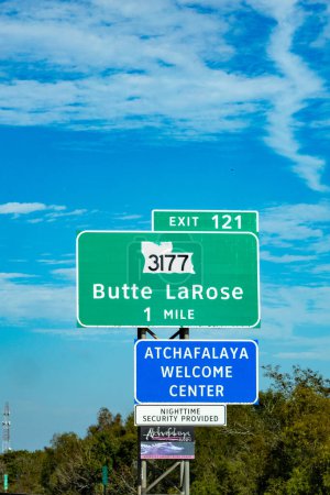 Photo for Atchafalaya, USA - October 23, 2023: sign Atchafalaya welcome center in one mile at the highway with provided nighttime security and alligator on signage, Louisiana - Royalty Free Image