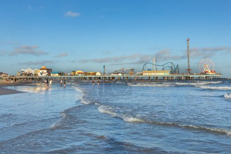 Photo for Galveston, USA - October 28, 2023: Pleasure Pier from the water in Galveston Island, Texas, USA. - Royalty Free Image
